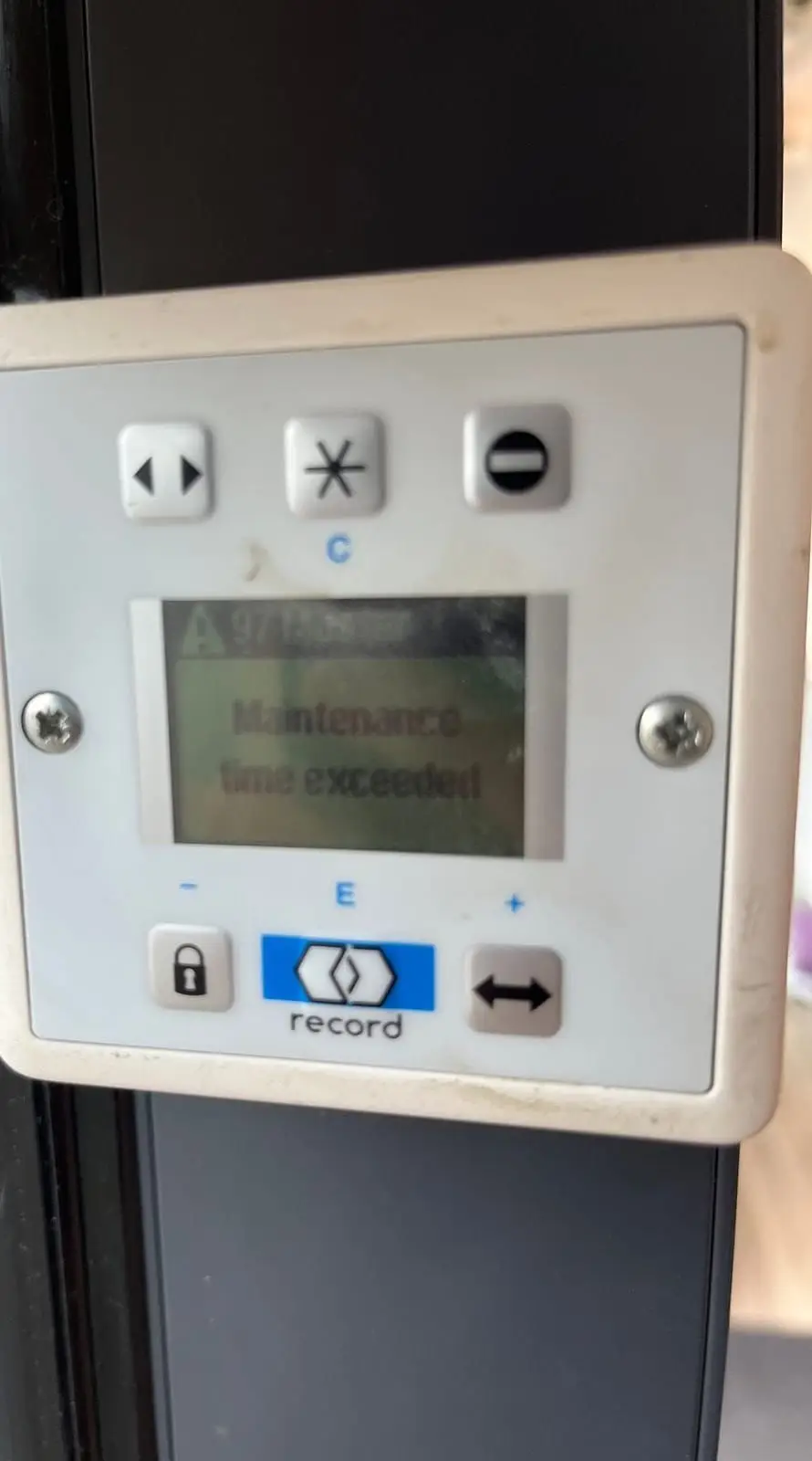 Automatic door programme switch showing a maintenance time exceeded message