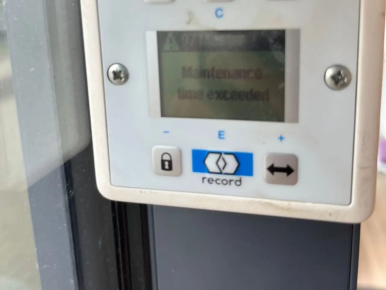 Automatic door programme switch showing a maintenance time exceeded message